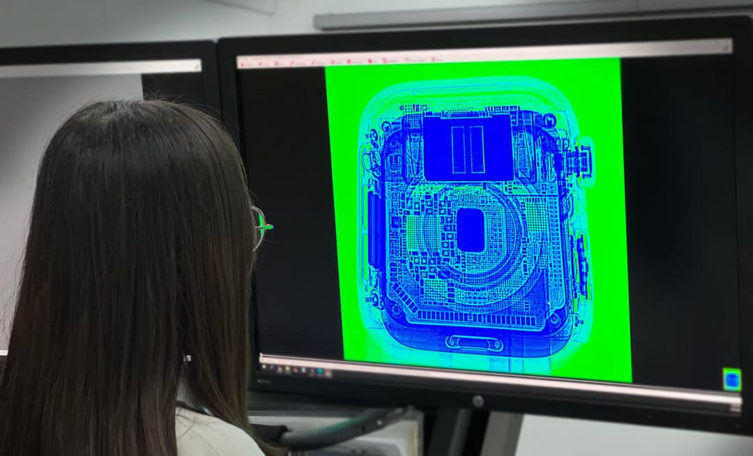 An engineer checking the digital radiography results for a tested sample.
