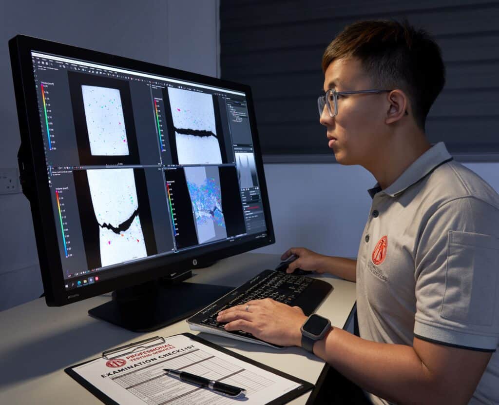 A PTS engineer reviewing 3D X-ray computed tomography scan data during a part inspection.